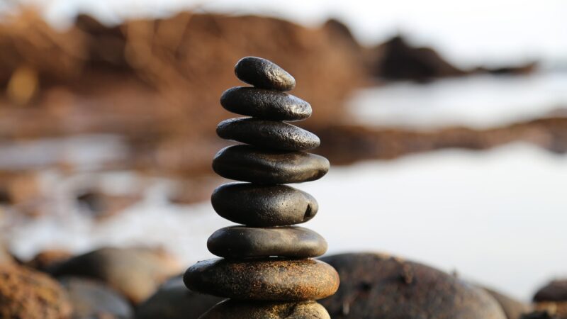 pile of rock near lake